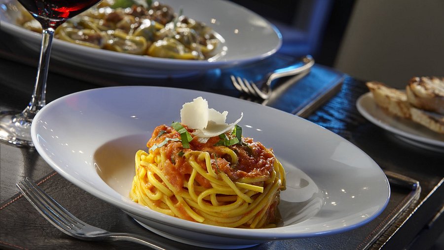 Scarpetta signature dishes Spaghetti with Tomato and BasilCreamy Polenta with Fricassee of Truffled MushroomsYellowtail Crudo